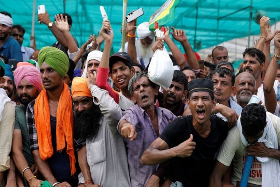 People shout slogans during a Maha Panchayat or grand village council meeting as part of a farmers' protest against farm laws in Muzaffarnagar in the northern state of Uttar Pradesh, India, September 5, 2021 -- Reuters