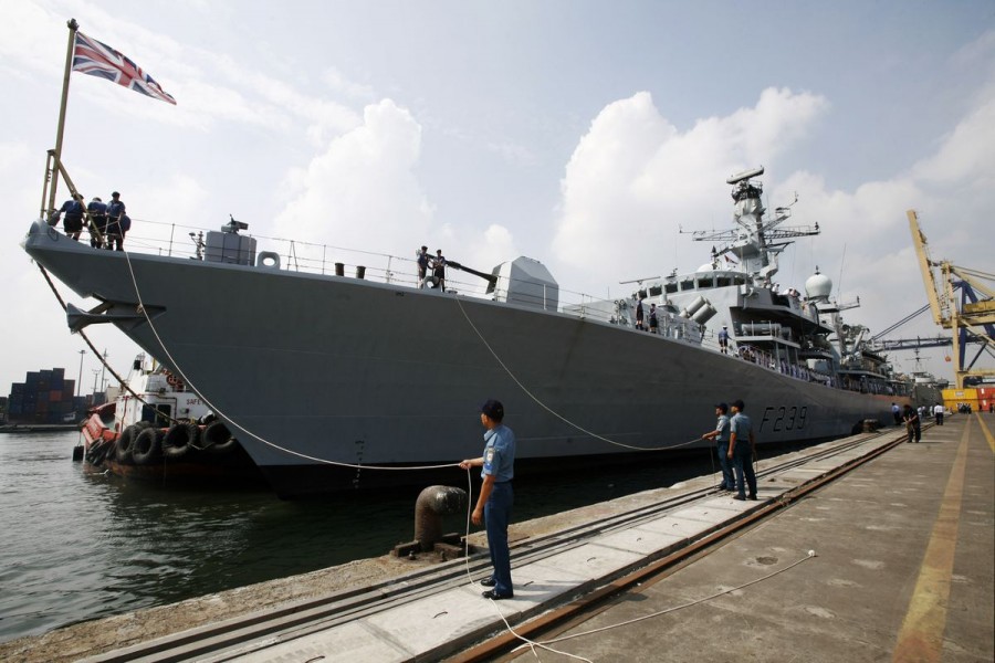 Officers of the Indonesian Navy greet the crew of the visiting British Royal Navy ship HMS Richmond docked at Tanjung Priok harbour in Jakarta May 22, 2011. REUTERS/Supri/Files