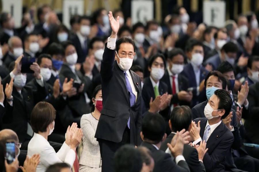 Former Japanese Foreign Minister Fumio Kishida gestures as he is elected as new head of the ruling party in the Liberal Democratic Party's (LDP) leadership vote in Tokyo, Japan September 29, 2021. Kyodo/via REUTERS