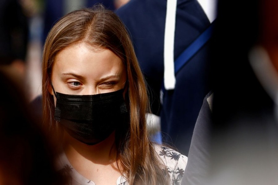 Swedish climate activist Greta Thunberg of Fridays for Future arrives for a news conference after meeting with Italy's Prime Minister Mario Draghi during a preparatory meeting ahead of the COP26 climate summit, in Milan, Italy, Sept 30, 2021 — Reuters/Guglielmo Mangiapane