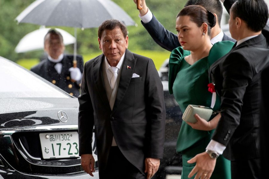 Philippines President Rodrigo Duterte arrives with daughter and first lady Sara Duterte-Carpio to attend the enthronement ceremony of Japan's Emperor Naruhito in Tokyo, Japan October 22, 2019 -- Carl Court/Pool via Reuters