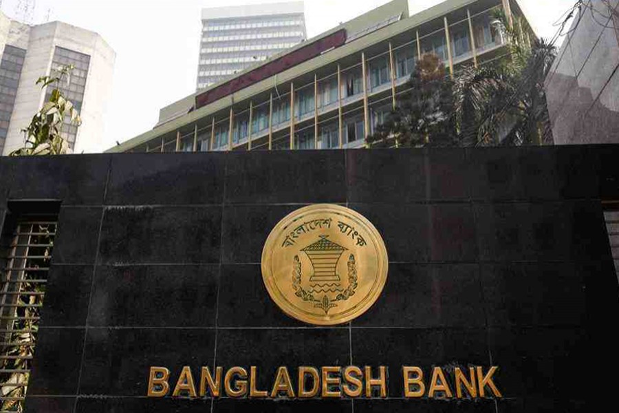 The Bangladesh Bank seal is pictured on the wall outside the central bank headquarters in Motijheel, the bustling commercial hub in capital Dhaka — File photo