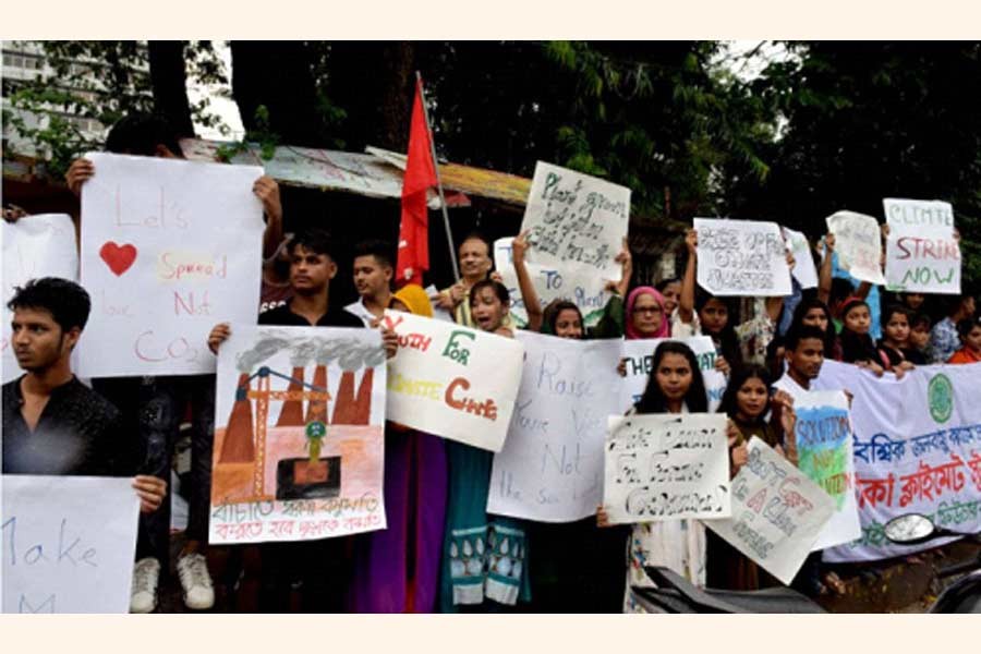 Protester at a rally in Dhaka demand climate justice.        —UNB Photo