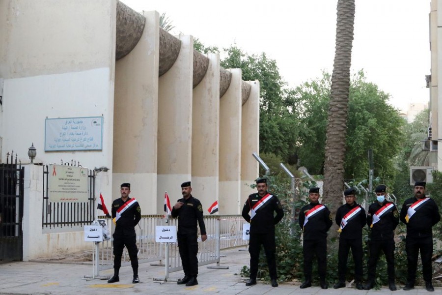 Iraqi security forces stand guard outside a polling station at the Green Zone in Baghdad, as Iraqis go to the poll to vote in the parliamentary election, in Iraq on October 10, 2021 — Reuters photo