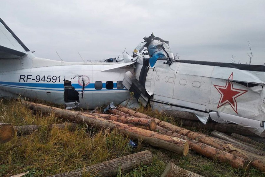 The wreckage of the L-410 plane is seen at the crash site near the town of Menzelinsk in the Republic of Tatarstan, Russia on October 10, 2021 — Russia's Emergencies Ministry/Handout via REUTERS