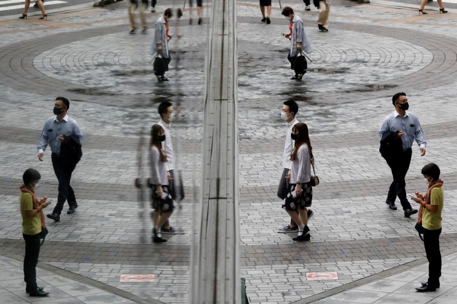 People wearing protective masks amid the coronavirus disease (COVID-19) outbreak make their way at a shopping district in Tokyo, Japan, September 9, 2021. REUTERS/Kim Kyung-Hoon/File Photo