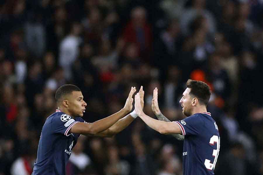 Paris St Germain's Lionel Messi celebrating scoring their second goal with Kylian Mbappe during Champions League’s Group A match against RB Leipzig at Paris on Tuesday –Reuters photo