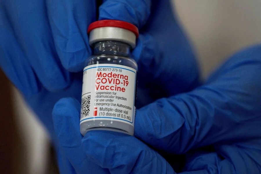 An employee shows the Moderna Covid-19 vaccine at Northwell Health's Long Island Jewish Valley Stream hospital in New York, US on December 21, 2020 — Reuters/Files