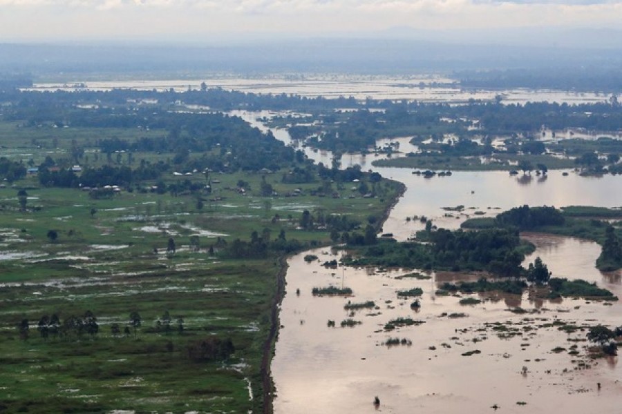 A general view shows a dyke holding flood waters, as River Nzoia burst its banks due to heavy rainfall and the backflow from Lake Victoria, in Budalangi within Busia County, Kenya May 3, 2020 – Reuters/Thomas Mukoya