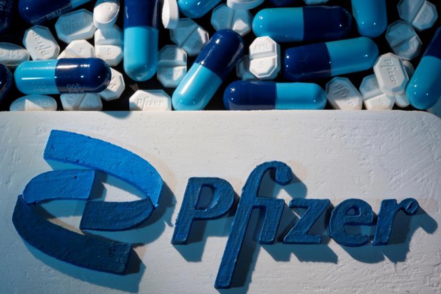 A 3D printed Pfizer logo is placed near medicines from the same manufacturer in this illustration taken on September 29, 2021 — Reuters/Files