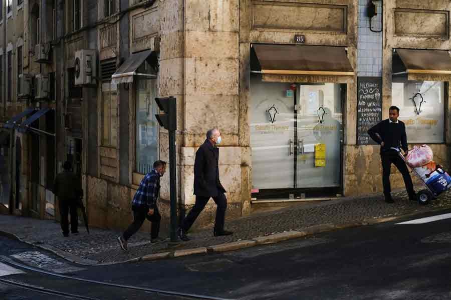 A man wearing a protective mask due to coronavirus disease (COVID-19) pandemic walking in central Lisbon of Portugal on November 25 this year –Reuters file photo