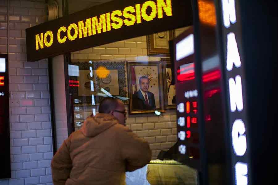 A portrait of Turkey's President Recep Tayyip Erdogan hanging in a money exchange shop in Istanbul of Turkey on Monday –AP Photo  