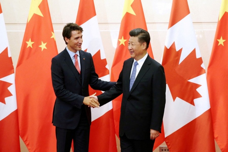 Chinese President Xi Jinping (R) shakes hands with Canadian Prime Minister Justin Trudeau ahead of their meeting at the Diaoyutai State Guesthouse in Beijing, China August 31, 2016 – Reuters/Files