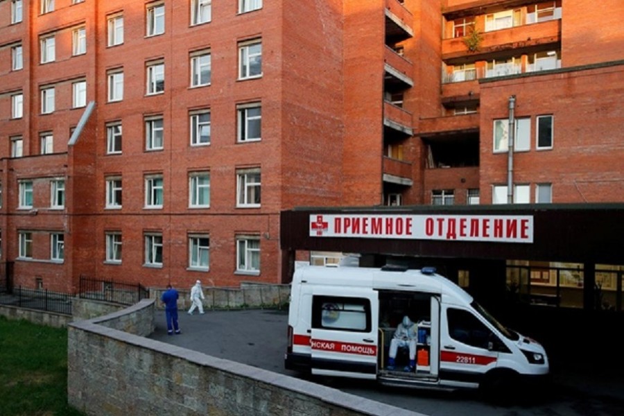 A medical specialist wearing protective gear sits in an ambulance parked at the Pokrovskaya hospital amid the outbreak of the coronavirus disease (COVID-19) in Saint Petersburg, Russia June 24, 2021. REUTERS/Anton Vaganov