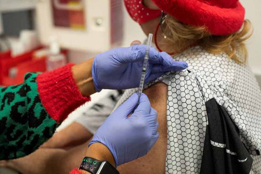 A nurse administering the coronavirus disease (COVID-19) vaccine booster at the North Oakland Health Center in Pontiac of Michigan in US on December 21 in 2021 -Reuters file photo