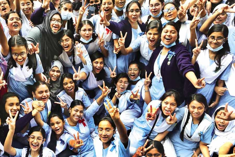 Students of Viqarunnisa Noon School and College flashing victory signs on the school campus in the city on Thursday, in celebration of their success in the SSC examinations —FE file photo