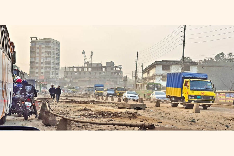 Movement of both vehicles and people has become almost impossible on the Joydevpur-Airport Road for haphazard construction work on the dedicated bus lane. The photo was taken on Monday — FE Photo