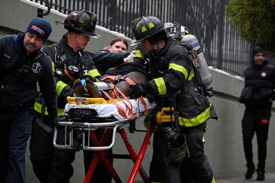 Emergency personnel from the FDNY provide medical aid as they respond to an apartment building fire in the Bronx borough of New York City, US on January 9, 2022 — Reuters photo