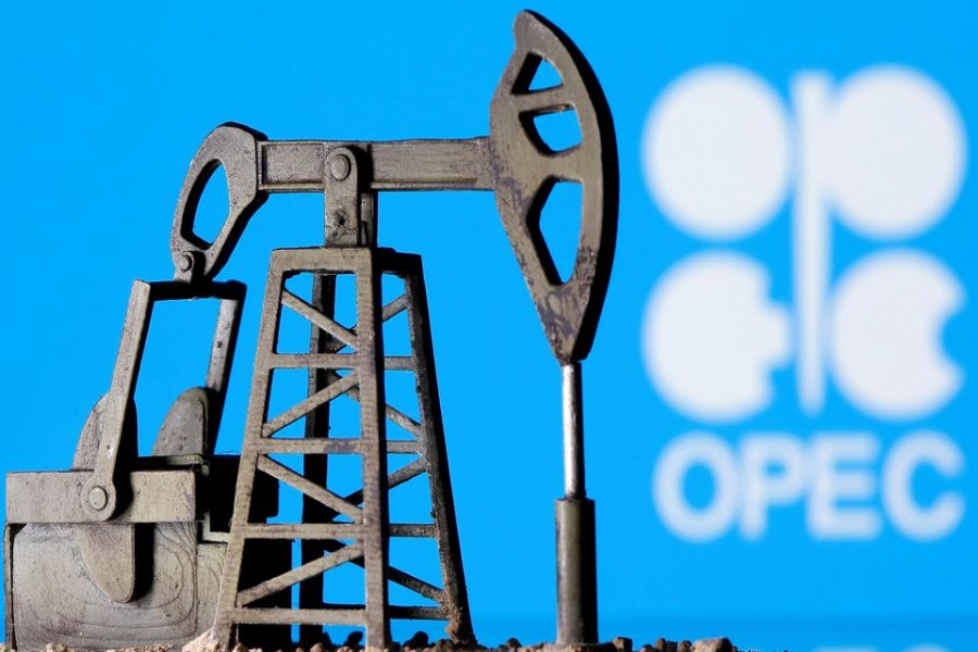 A 3D printed oil pump jack is seen in front of displayed Opec logo in this illustration picture, April 14, 2020 – Reuters/Dado Ruvic/Illustration