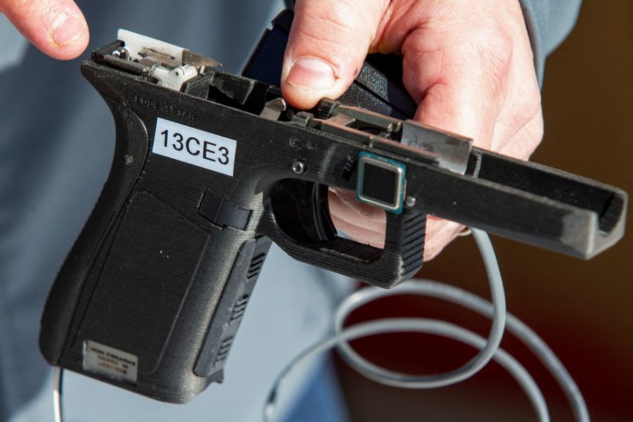 Rob Regent of SGW Designworks breaks down the inner working of the 9mm smart gun, which works only for the designated user, during a presentation for shareholders and potential investors in Boise, Idaho, US January 7, 2022. REUTERS/Brian Losness