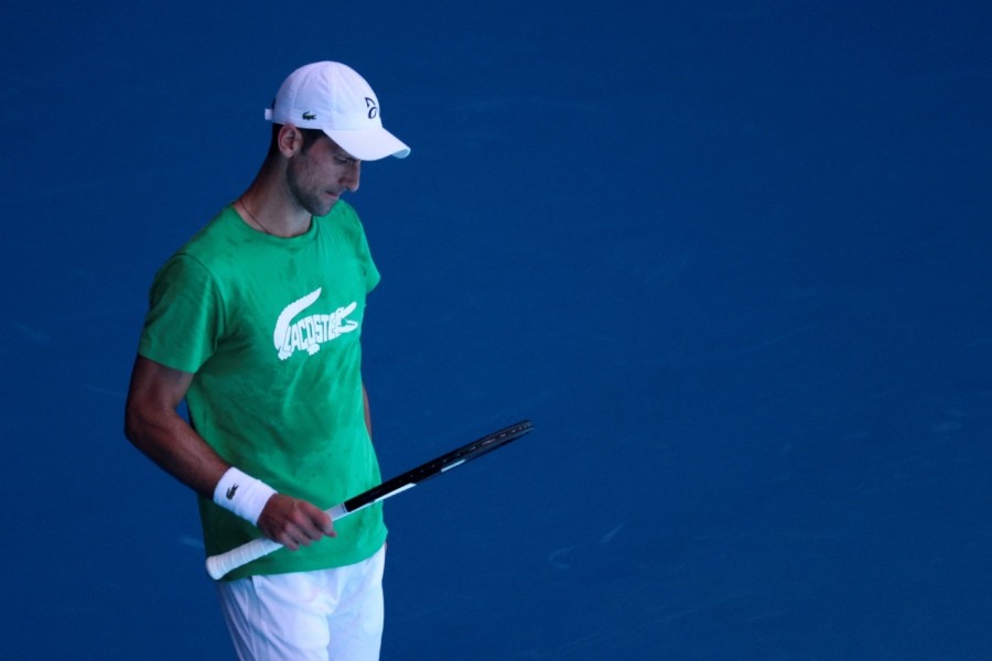 Serbian tennis player Novak Djokovic practices at Melbourne Park as questions remain over the legal battle regarding his visa to play in the Australian Open in Melbourne, Australia, January 13, 2022. REUTERS/Loren Elliott