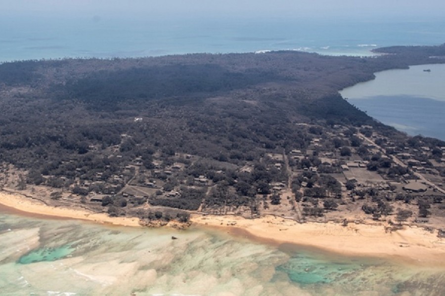 A general view from a New Zealand Defence Force P-3K2 Orion surveillance flight shows heavy ash fall over Nomuka in Tonga after the Pacific island nation was hit by a tsunami triggered by an undersea volcanic eruption Jan 17, 2022. REUTERS