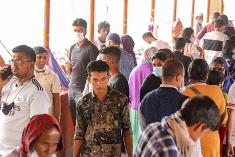 Some people are not wearing masks amid crowds defying government orders and a surge in coronavirus infections. The photo was taken from the New Market area of Dhaka on Wednesday. Photo: bdnews24.com