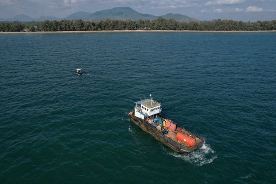 Vessels wait to clean oil spills caused by a leak from an undersea pipeline 20 km (12.4 miles) off Thailand's eastern coast at Mae Ramphueng beach in Rayong province, Thailand, January 30, 2022. Picture taken with a drone. REUTERS/Soe Zeya Tun