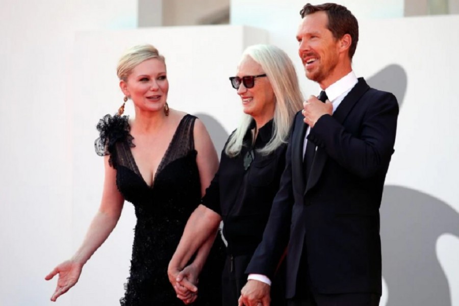 The 78th Venice Film Festival - Screening of the film 'The Power of the Dog' in competition - Red Carpet Arrivals - Venice, Italy September 2, 2021 - Director Jane Campion, actor Benedict Cumberbatch and actor Kirsten Dunst pose. REUTERS/Yara Nardi