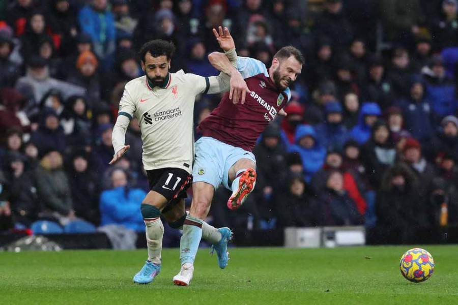 Soccer Football - Premier League - Burnley v Liverpool - Turf Moor, Burnley, Britain - February 13, 2022 Liverpool's Mohamed Salah in action with Burnley's Erik Pieters —Reuters/Russell Cheyne