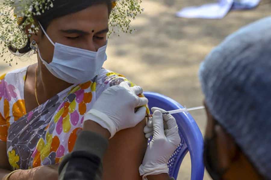 A transgender person receiving a shot of Johnson & Johnson COVID-19 vaccine in Dhaka's central Shaheed Minar area on Monday –bdnews24.com file photo