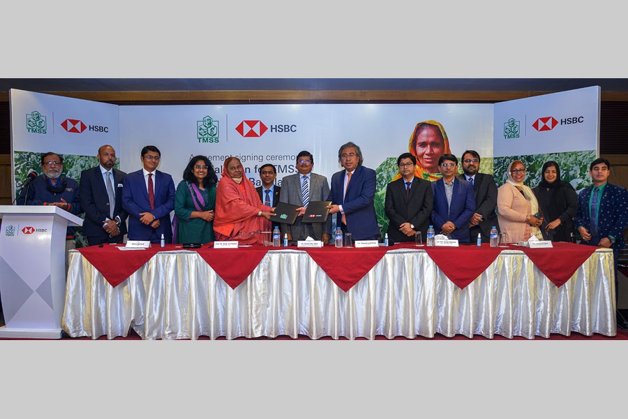 Professor Dr Hosne Ara Begum, founder and executive director of TMSS, Shaikh Md Salim, executive director of Bangladesh Bank Bogura Office, and Md Mahbub ur Rahman, CEO of HSBC Bangladesh are seen at the agreement signing ceremony of Bangladesh’s first SLP-based financing