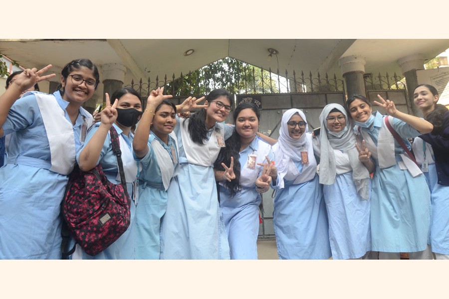 This group of students of  Viqarunnisa Noon School and College in Dhaka show victory signs after their brilliant results in this year's HSC exams that came out on Sunday