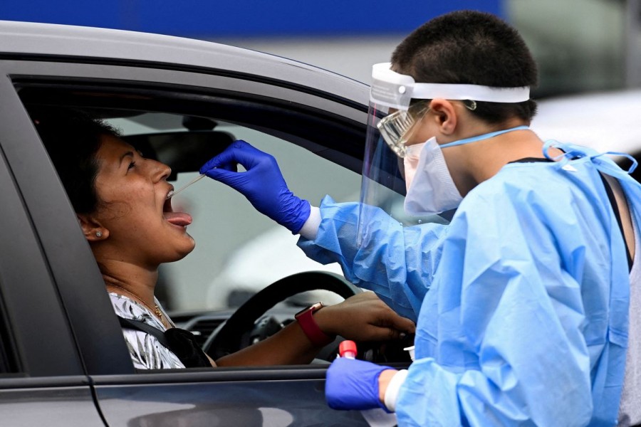 A woman takes a test for the coronavirus disease (COVID-19) at a testing centre in Sydney, Australia, January 5, 2022. REUTERS/Jaimi Joy