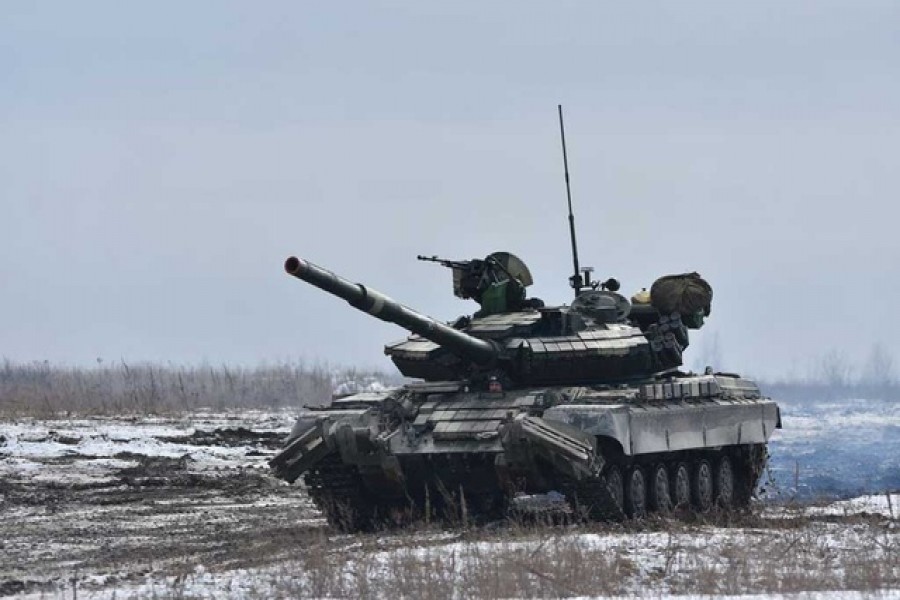 Ukrainian servicemen drive a tank during drills at a training ground in unknown location in Ukraine, in this handout picture released Feb 18, 2022 — Ukrainian Joint Forces Operation Press Service/Reuters