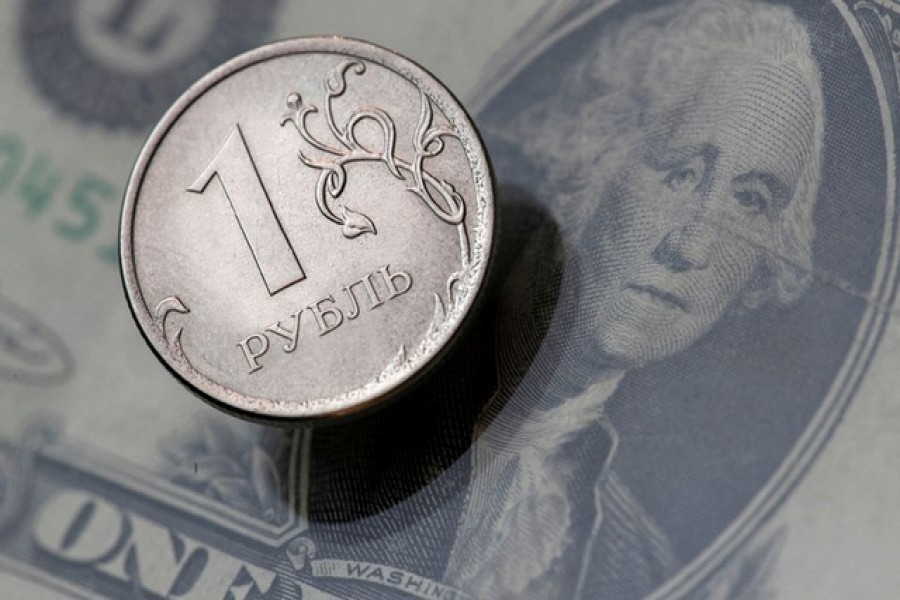 A view shows a Russian rouble coin and a US dollar banknote in this picture illustration taken October 26, 2018 — Reuters/Files