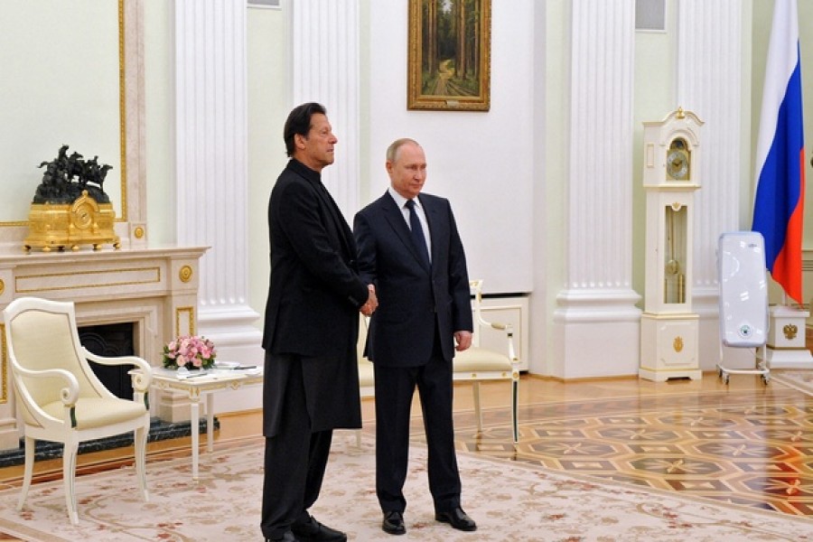 Russian President Vladimir Putin shakes hands with Pakistan's Prime Minister Imran Khan during a meeting in Moscow, Russia February 24, 2022  — Sputnik/Mikhail Klimentyev/Kremlin via Reuters