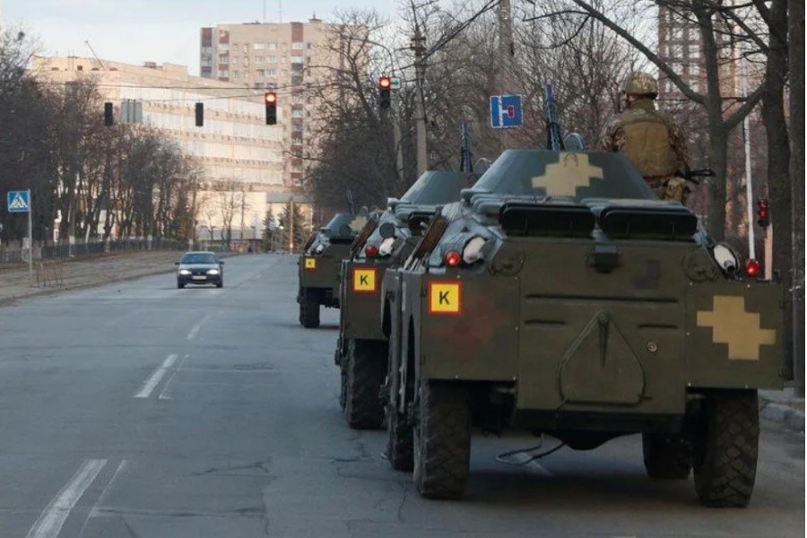 A Ukrainian service member is seen atop of an armoured personal carrier in Kyiv - Reuters