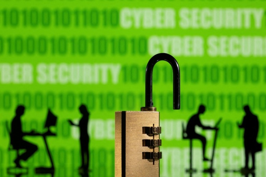 3D printed models of people working on computers and padlock are seen in front of a displayed CYBER SECURITY words and binary code in this picture illustration taken, February 1, 2022. REUTERS