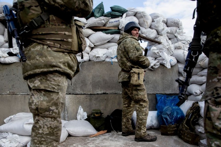 Ukrainian service members are seen after Russia launched a massive military operation against Ukraine, at a check point in the city of Zhytomyr, Ukraine February 27, 2022. REUTERS/Viacheslav Ratynskyi