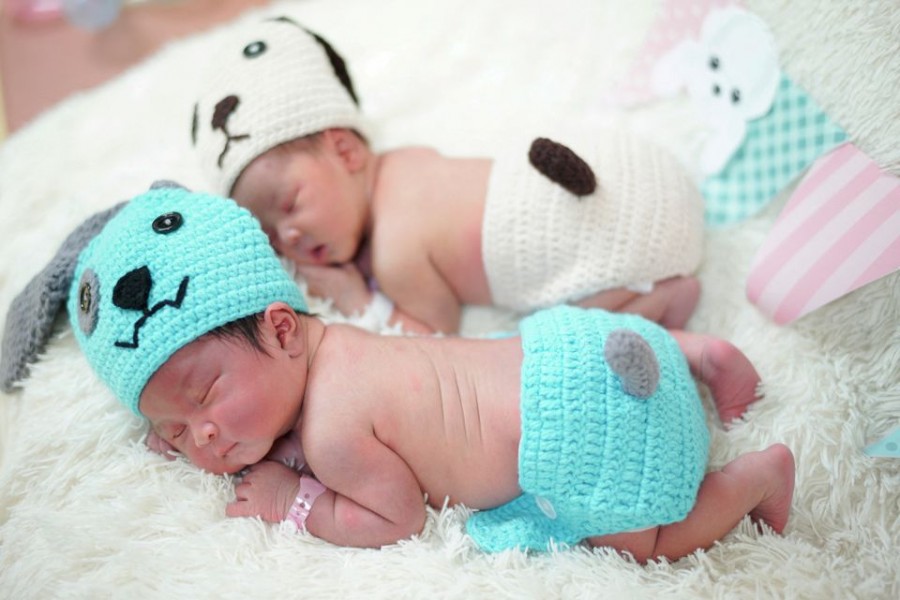 Newborn babies wearing dog costumes to celebrate the New Year of the Dog are pictured at the nursery room of Paolo Chokchai 4 Hospital in Bangkok, Thailand, December 28, 2017. REUTERS/Athit Perawongmetha