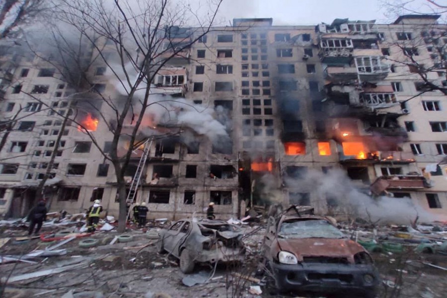 Rescuers work next to a residential building damaged by shelling, as Russia's attack on Ukraine continues, in Kyiv, Ukraine, in this handout picture released March 14, 2022. Press service of the State Emergency Service of Ukraine/Handout via REUTERS