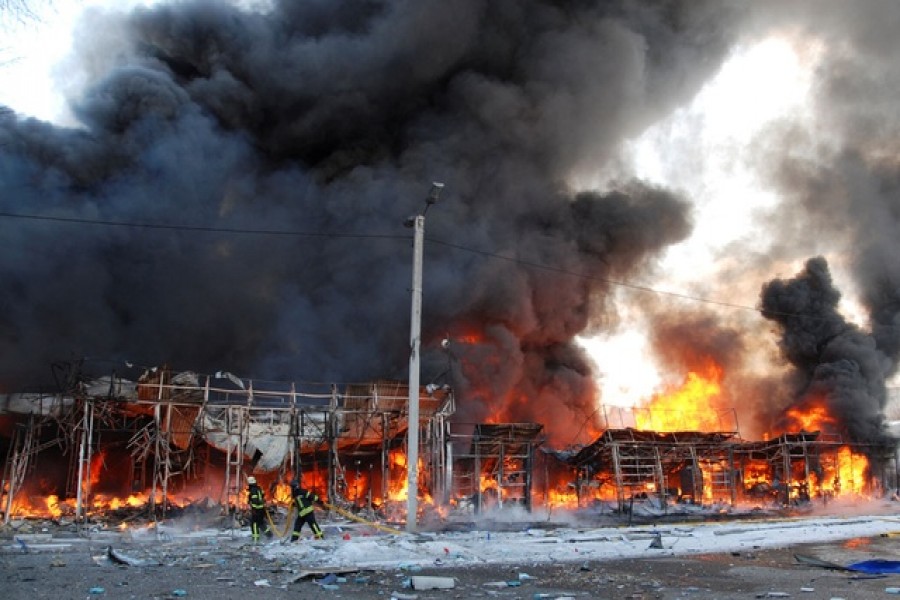 Firefighters work at a site of a fire, as Russia's invasion of Ukraine continues, in Kharkiv, Ukraine March 16, 2022 -- Reuters