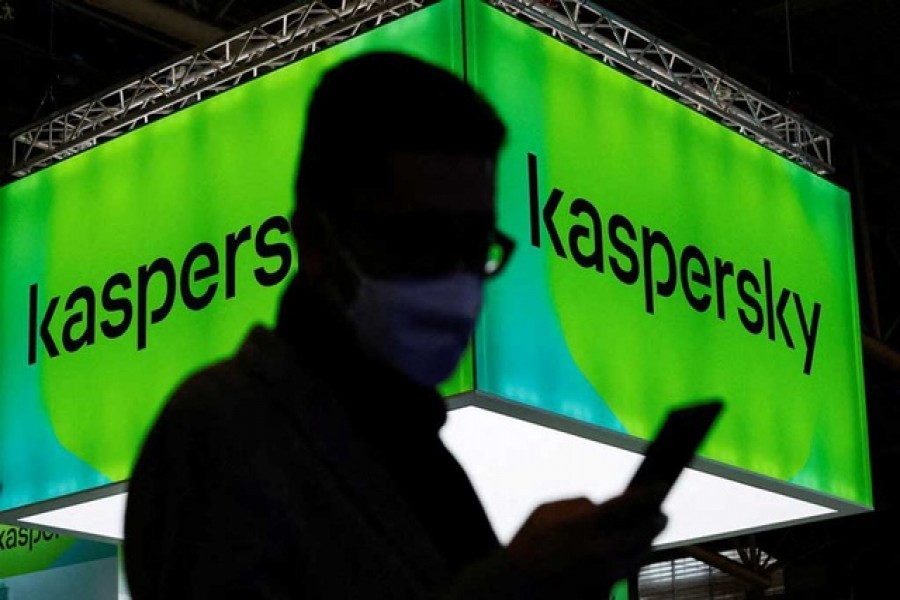 A man walks next to Russian Kaspersky stand during the GSMA's 2022 Mobile World Congress (MWC), in Barcelona, Spain, Mar 2, 2022. REUTERS/Albert Gea