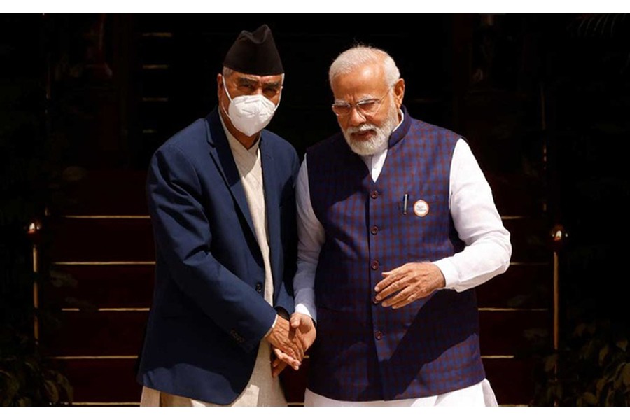 Nepal's Prime Minister Sher Bahadur Deuba speaks his Indian counterpart Narendra Modi ahead of their meeting at Hyderabad House in New Delhi, India Apr 2, 2022. REUTERS/Adnan Abid