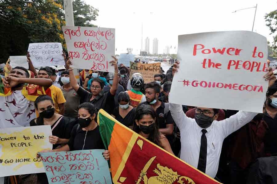 People staging demonstration in Colombo on Tuesday demanding resignation of Sri Lanka's President Gotabaya Rajapaksa after his government lost its majority in the parliament amid the country's economic crisis –Reuters photo