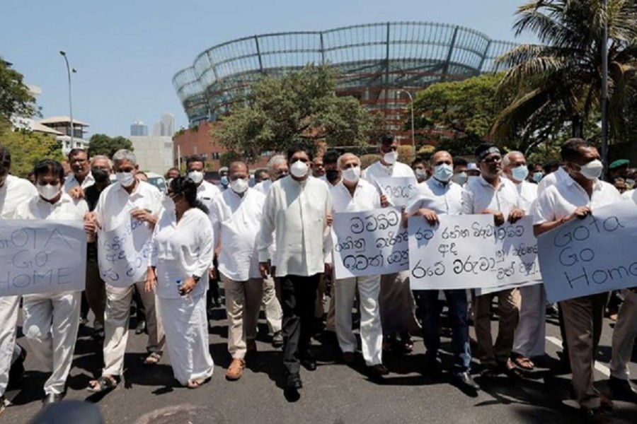 Sajith Premadasa, leader of the opposition alliance, Samagi Jana Balawegaya, marches along with other opposition lawmakers towards Independence Square as they shout slogans against President Gotabaya Rajapaksa after the government imposed a curfew following a clash between police and protestors near Sri Lankan President Gotabaya Rajapaksa's residence during a protest last Thursday, amid the country's economic crisis, in Colombo, Sri Lanka Apr 3, 2022. REUTERS/Dinuka Liyanawatte