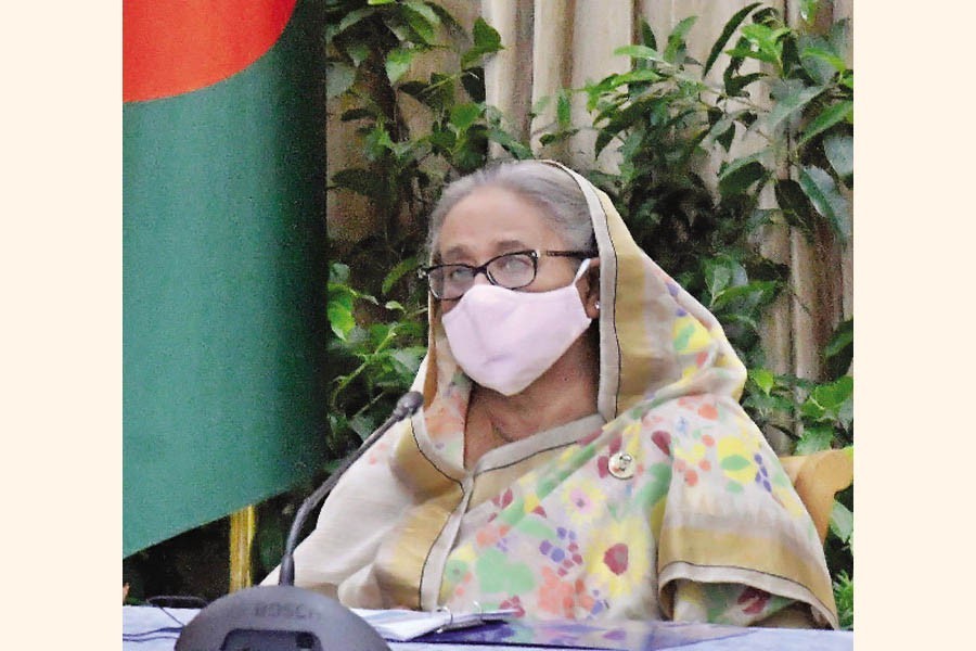 Prime Minister Sheikh Hasina witnesses a presentation on 'Offshore tax amnesty' and 'Review of Bangladesh's macro economy against the backdrop of Sri Lankan economic crisis', at Ganobhaban on Tuesday — Focus Bangla