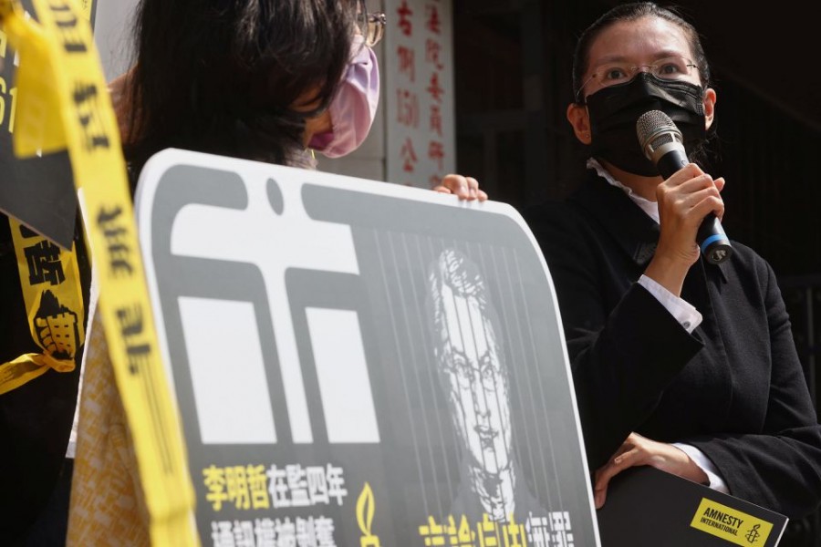 Li Ching-yu, the wife of Taiwan activist Li Ming-che, sentenced to five years in prison by Chinese authorities for subverting state power speaks to the press on the fourth anniversary of his imprisonment in Taipei, Taiwan on March 19, 2021 — Reuters photo