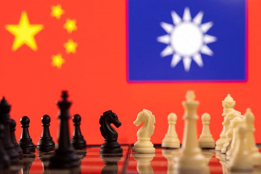 Chess pieces are seen in front of displayed China and Taiwan's flags in this illustration taken January 25, 2022. REUTERS/Dado Ruvic/Illustration